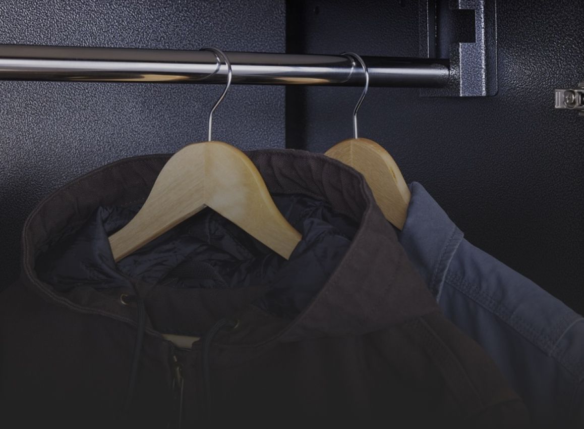 Two jackets with hangers on a rod in a Gladiator Storage System